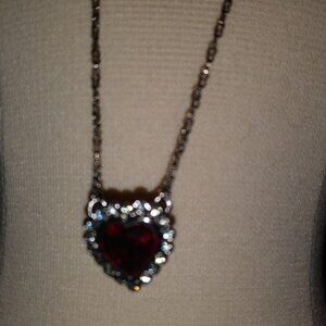 Swarovski: pretty red heart pendant on a chain, has swan logo on necklace.